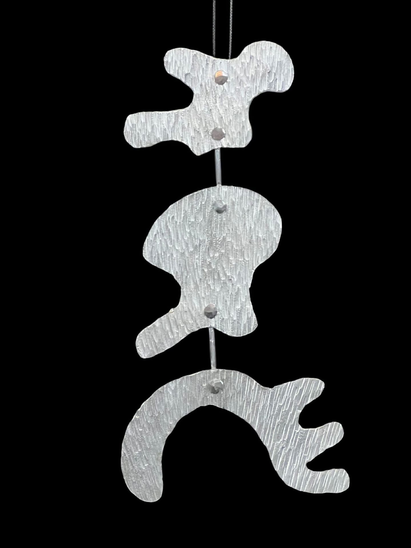 Unique Forms of Continuity in Space— Cold Forged Aluminum Pendant